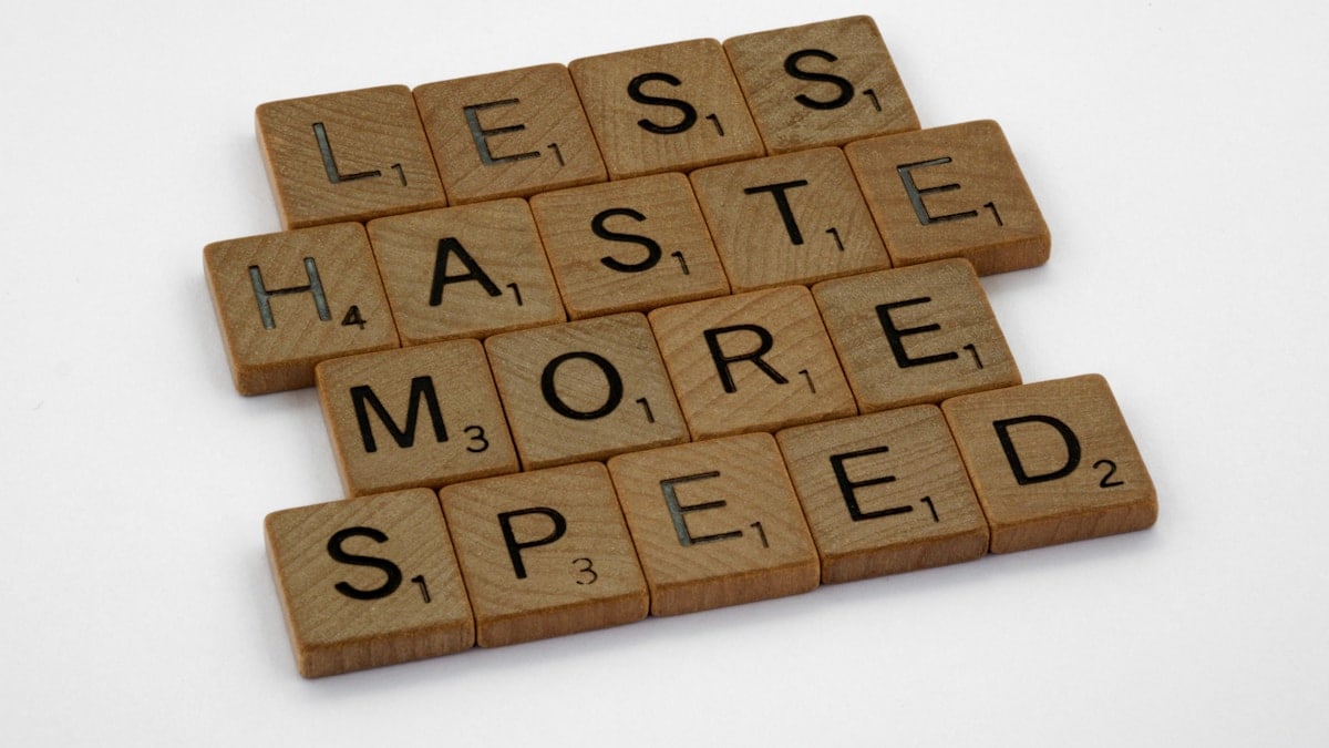 scrabble, scrabble pieces, lettering, letters, wood, scrabble tiles, white background, words, quote, letters, type, typography, design, layout, focus, bokeh, blur, photography, images, image, less haste more speed, slow down, measure twice cut once, breathe, concentrate, do not panic, do not rush, rush job, panic, anxiety,